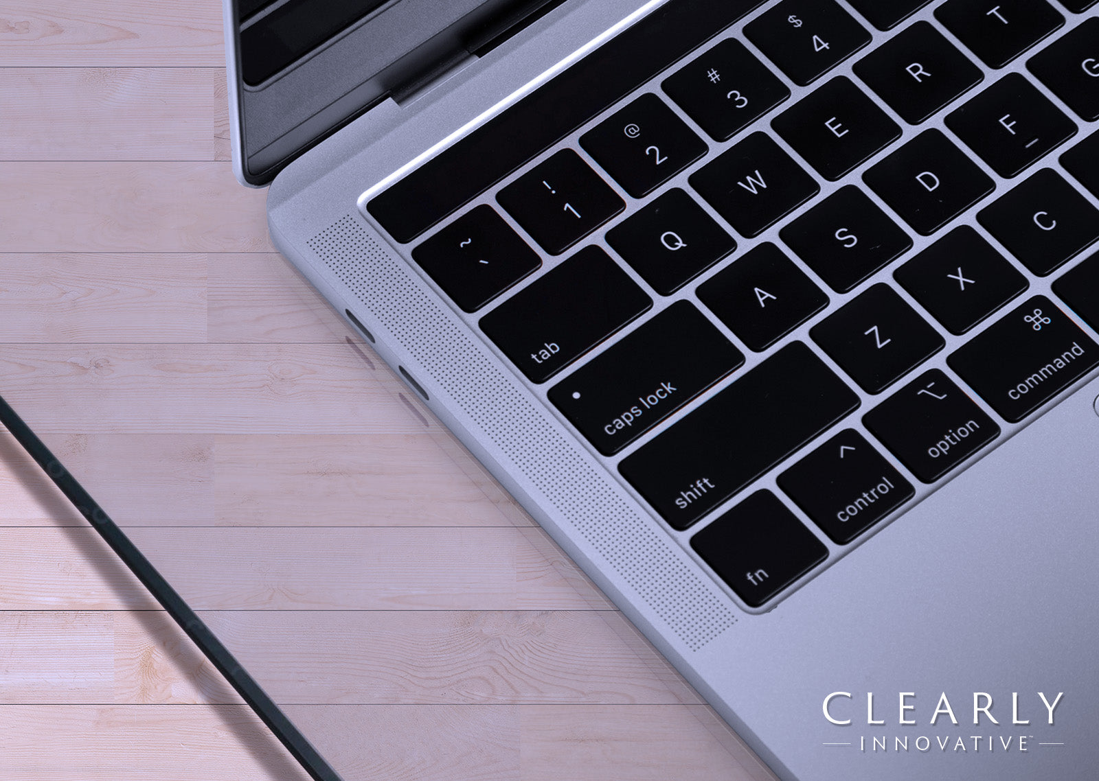 Laptop on a Clearly Innovative glass desk pad